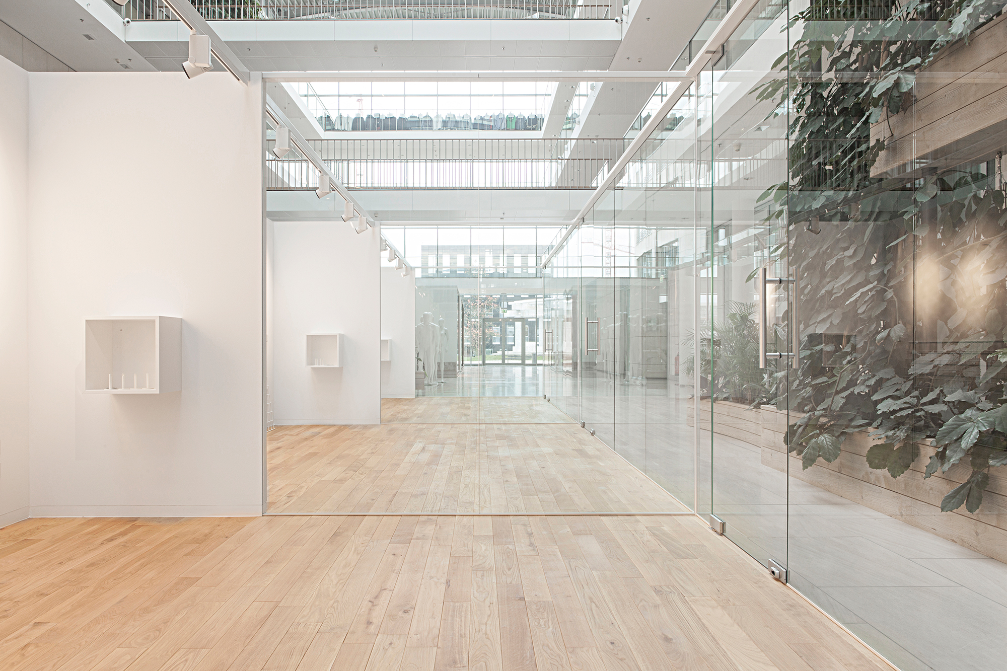 Two indoor glass buildings for multiple use at Esprit's headquarters designed by formlos.com