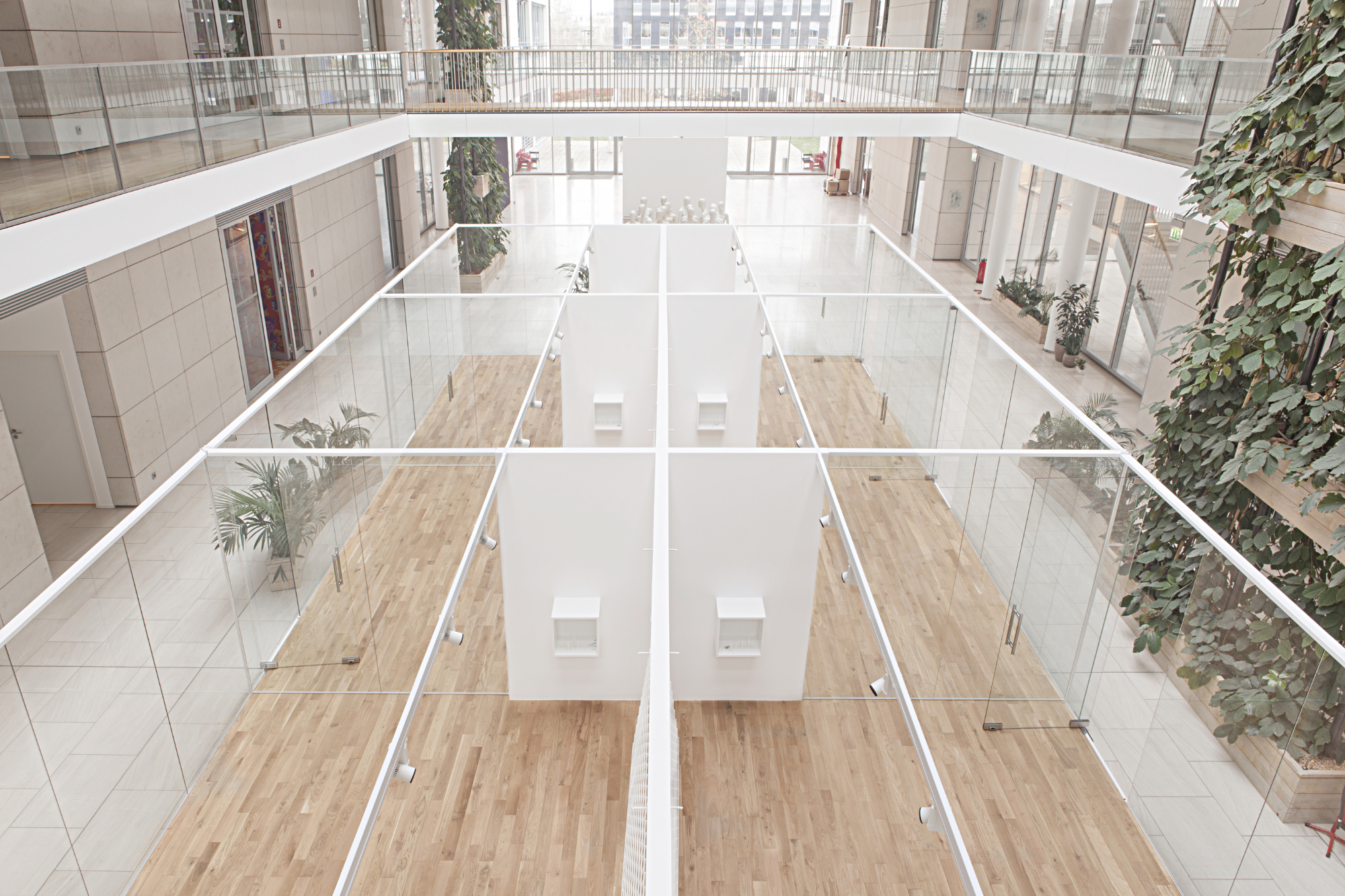 Two indoor glass buildings for multiple use at Esprit's headquarters designed by formlos.com