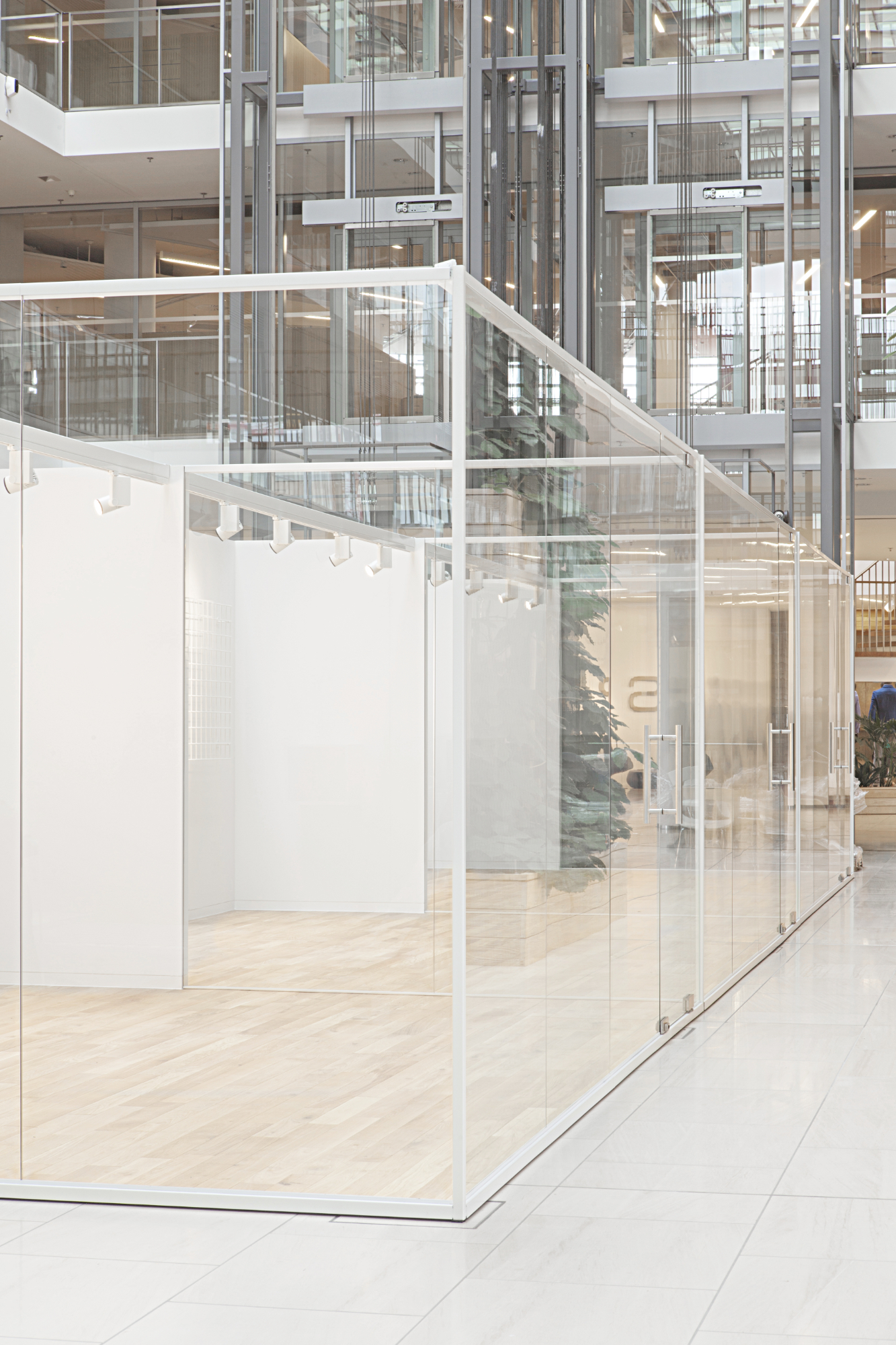 Two indoor glass buildings for multiple use at Esprit's headquarters designed by formlos.com