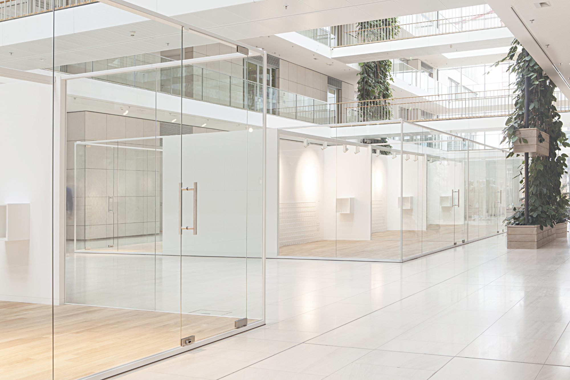 Two indoor glass buildings for multiple use at Esprit's headquarters designed by formlos.com Two indoor glass buildings for multiple use at Esprit's headquarters designed by formlos.com